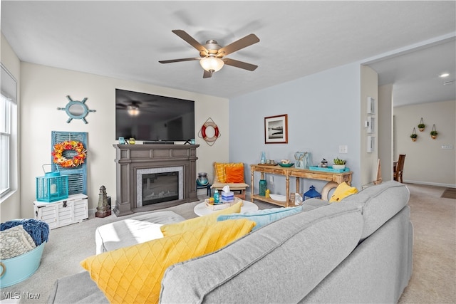 living room with light carpet and ceiling fan