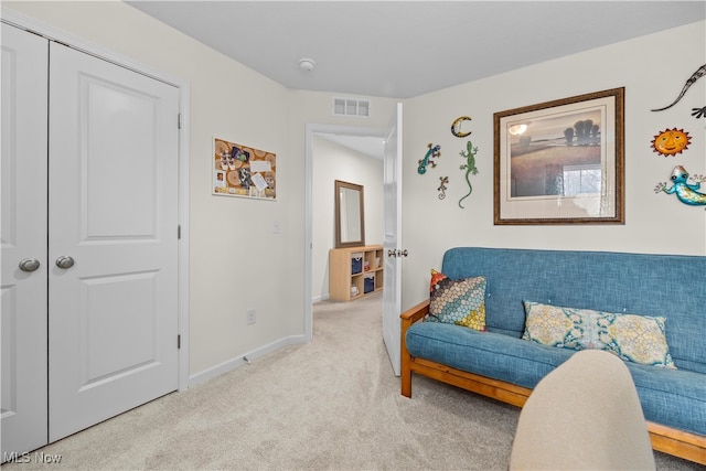 sitting room with light colored carpet