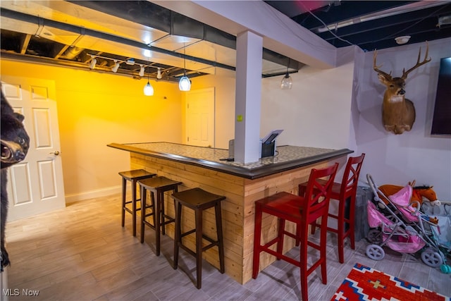 bar featuring wood-type flooring