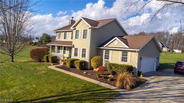 view of front facade with a garage and a front yard