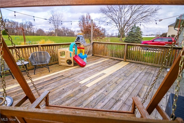 wooden terrace with a yard