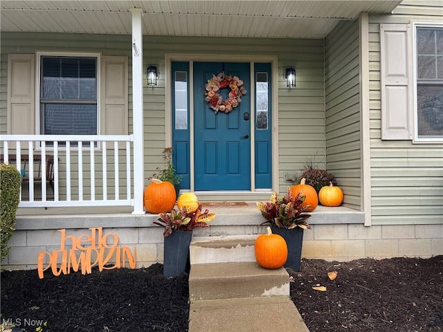 doorway to property with a porch