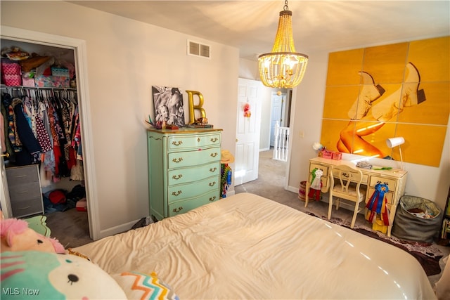 bedroom featuring dark carpet, an inviting chandelier, and a closet