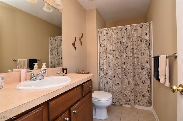 bathroom with tile patterned flooring, vanity, a shower with shower curtain, and toilet