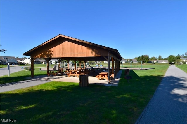 view of property's community with a yard