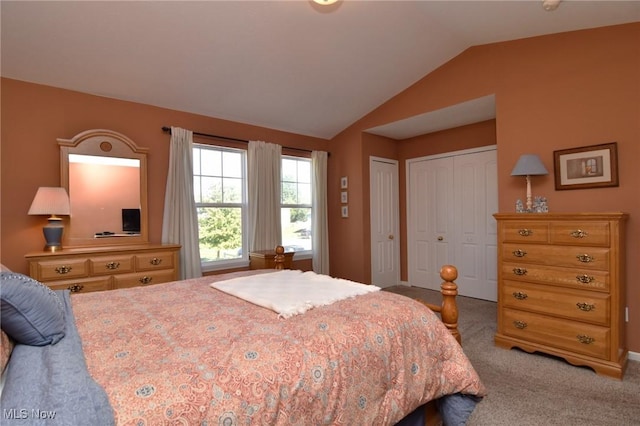 carpeted bedroom featuring vaulted ceiling