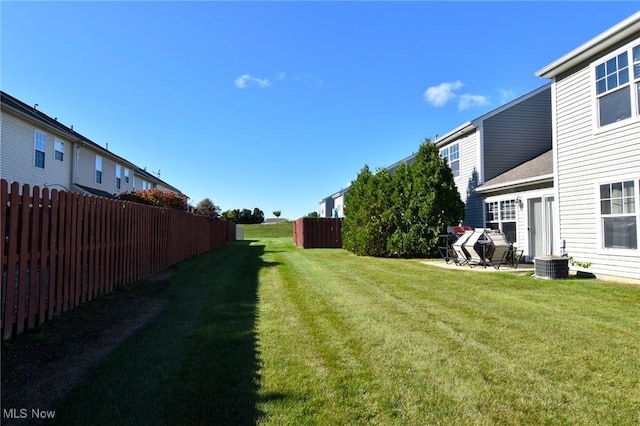 view of yard with a patio area and central air condition unit