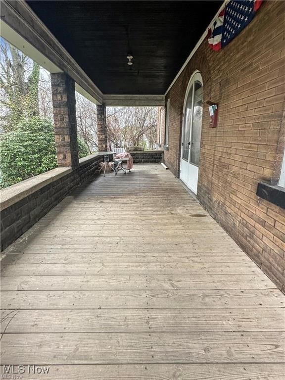 wooden terrace featuring a porch