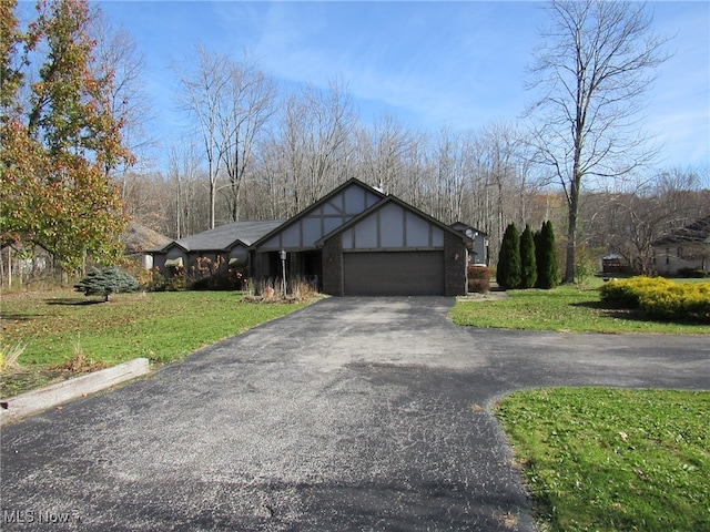 view of front of home with a garage and a front yard