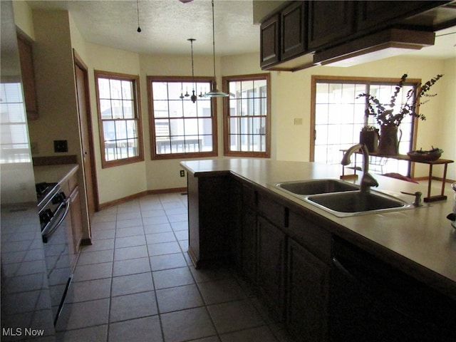 kitchen featuring a chandelier, decorative light fixtures, plenty of natural light, and sink