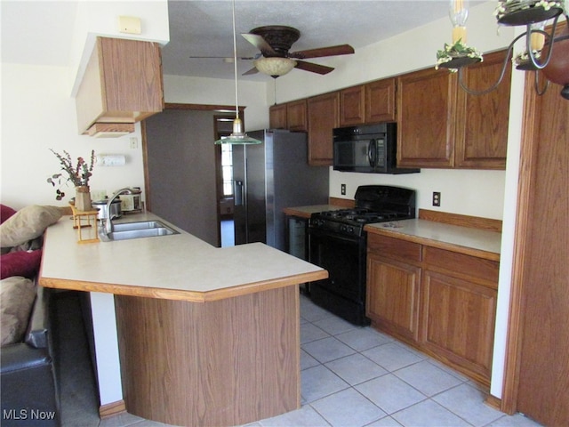 kitchen featuring black appliances, sink, ceiling fan, light tile patterned flooring, and kitchen peninsula