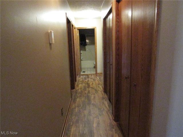 hall with dark hardwood / wood-style floors