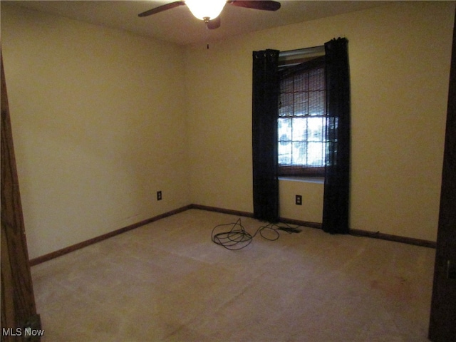 carpeted empty room with ceiling fan