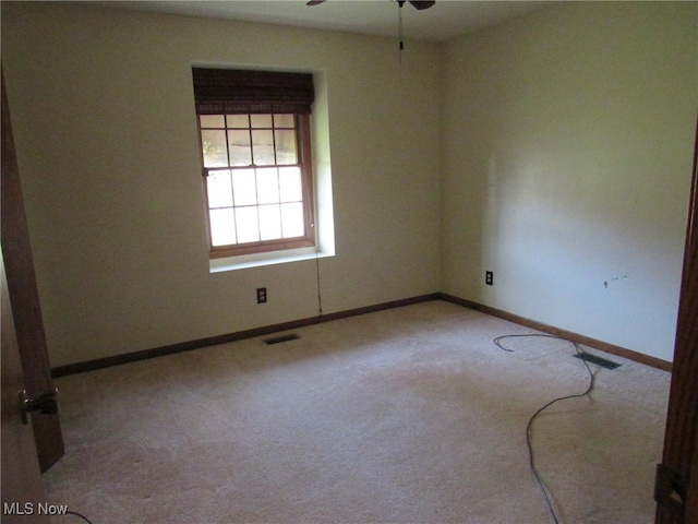 carpeted empty room with ceiling fan