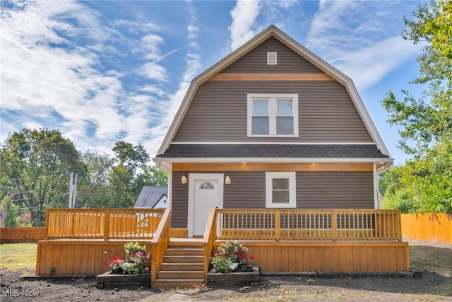 view of front of house with a wooden deck