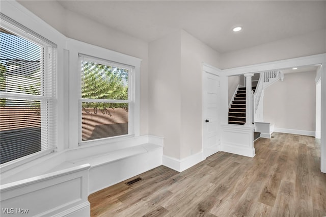 interior space featuring a healthy amount of sunlight and light hardwood / wood-style flooring