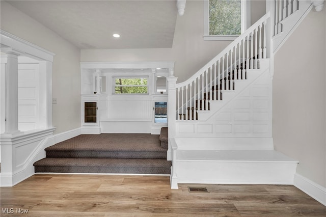 staircase featuring hardwood / wood-style flooring