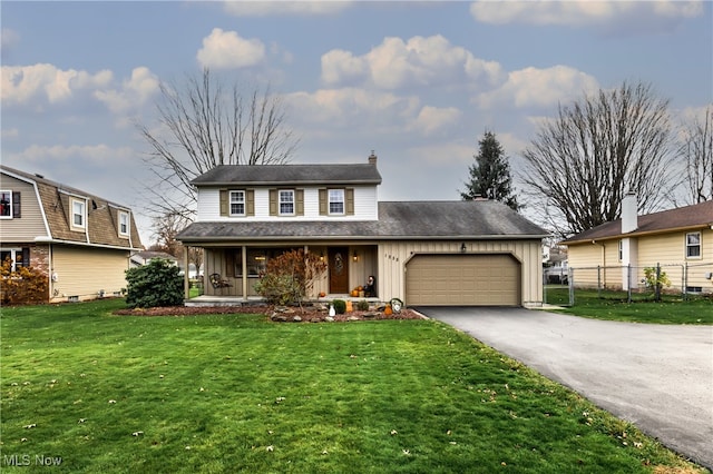 view of front facade with a front yard and a garage