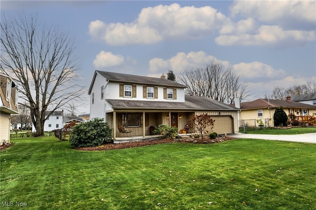 view of front of home featuring a garage and a front yard