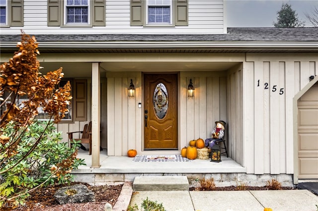 doorway to property featuring a porch