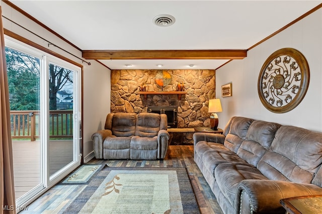 living room with beam ceiling, a stone fireplace, crown molding, and wood-type flooring