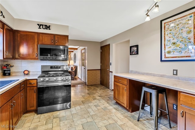 kitchen featuring decorative backsplash and appliances with stainless steel finishes