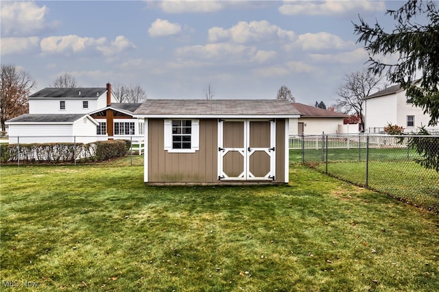 view of outbuilding featuring a lawn