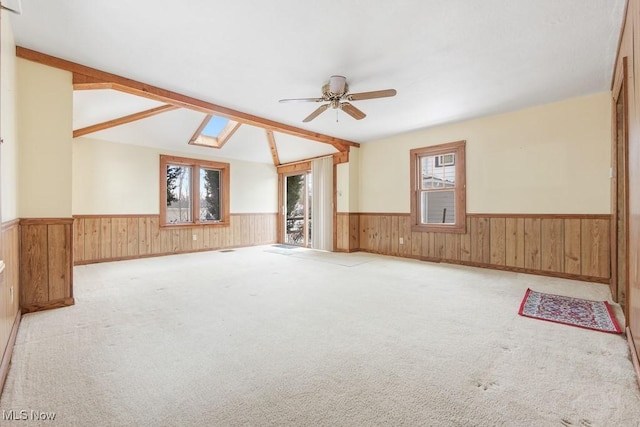 18061 Derr Ave, Beloit, OH 44609 - unfurnished room featuring a wainscoted wall, a ceiling fan, wooden walls, and carpet flooring