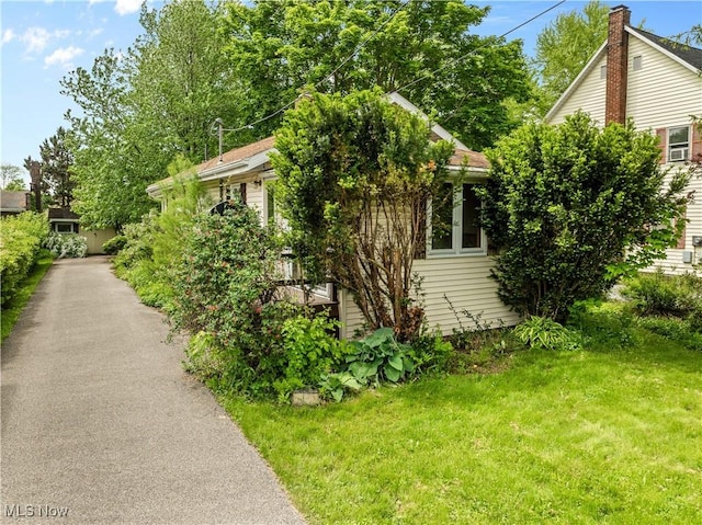 18061 Derr Ave, Beloit, OH 44609 - view of home's exterior with a lawn