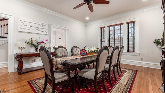 dining space with hardwood / wood-style flooring, ceiling fan, and ornamental molding