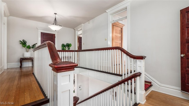 stairs featuring hardwood / wood-style flooring