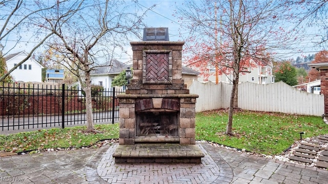 view of patio / terrace with an outdoor stone fireplace