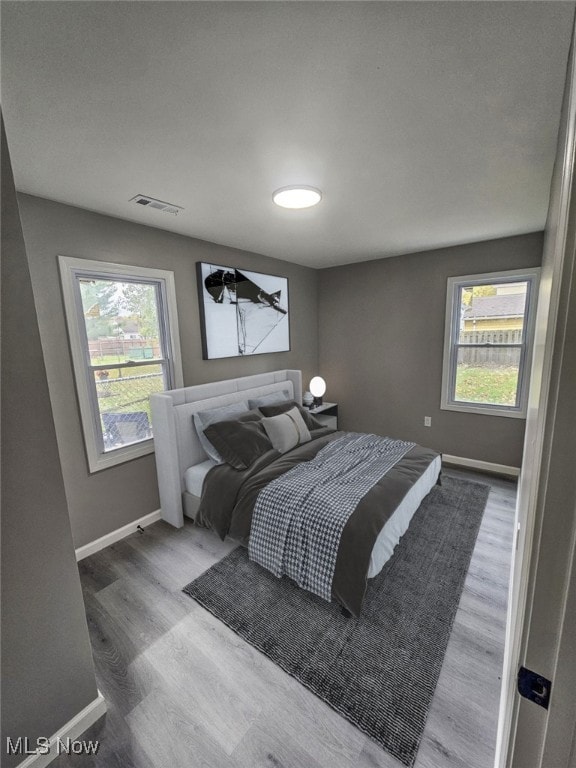 bedroom featuring wood-type flooring