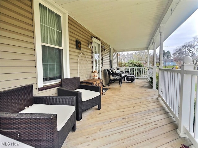 wooden terrace featuring a porch