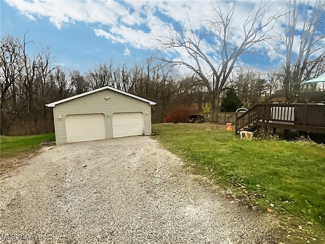 garage featuring a lawn