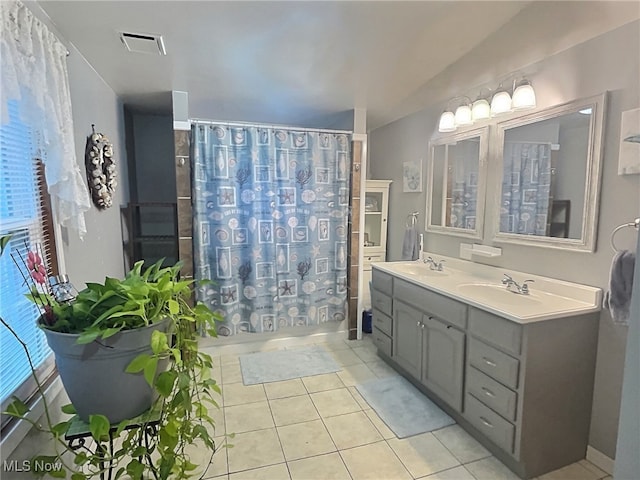 bathroom with tile patterned flooring, vanity, and a shower with shower curtain