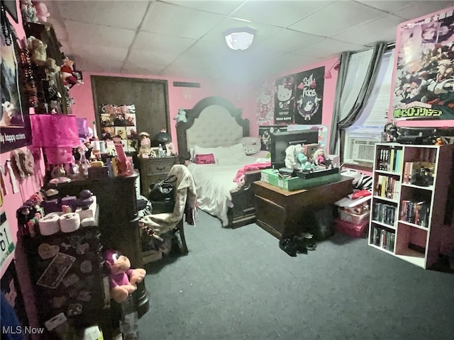 carpeted bedroom featuring a paneled ceiling