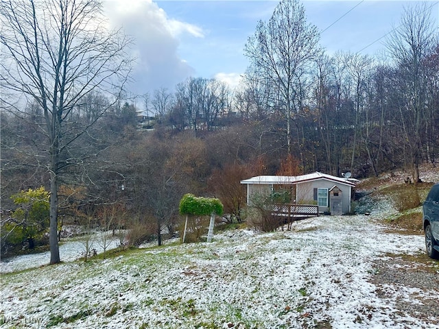 view of yard with a wooden deck