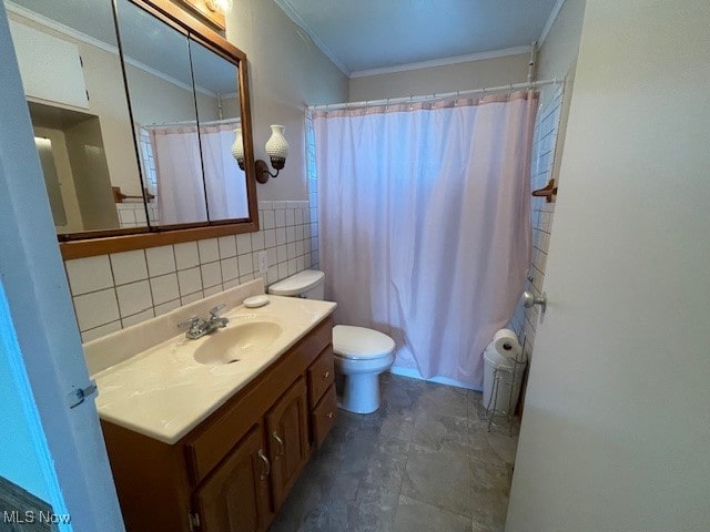 bathroom with vanity, ornamental molding, and toilet