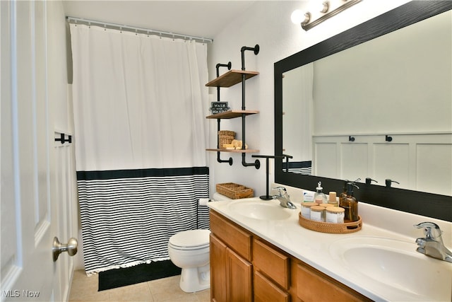 bathroom with tile patterned floors, vanity, toilet, and a shower with shower curtain