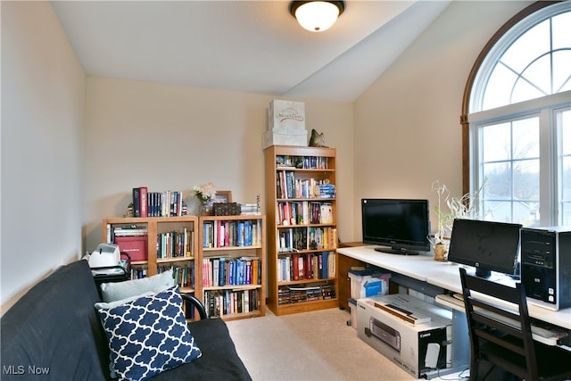 office with light colored carpet and lofted ceiling