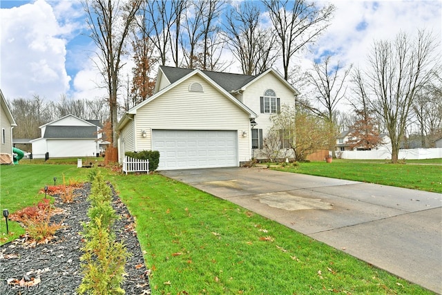 front of property featuring a front yard and a garage