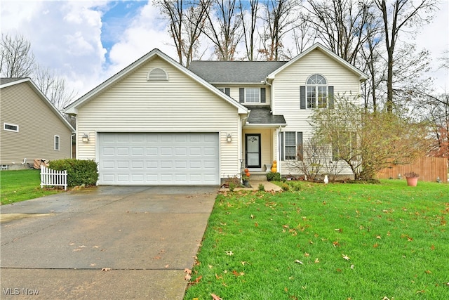 front of property with a front lawn and a garage