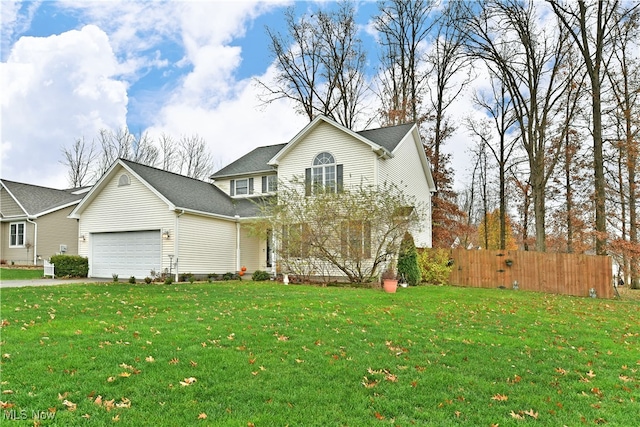 view of front property with a garage and a front lawn