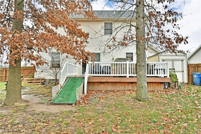 back of house featuring a deck