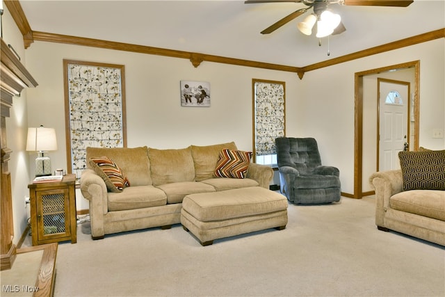 living room with ceiling fan, carpet floors, and ornamental molding