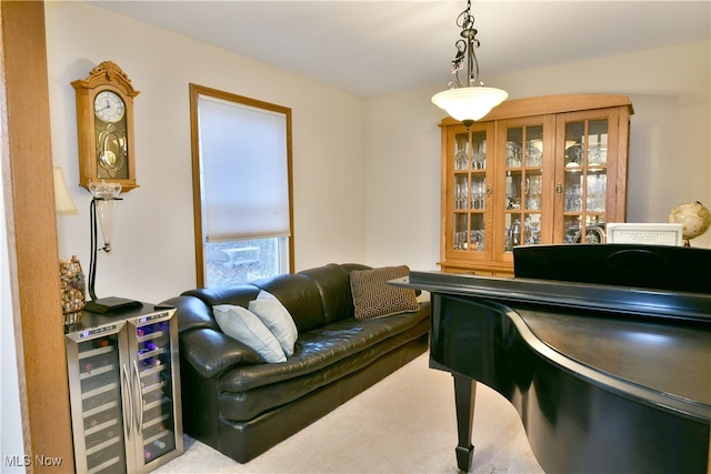 misc room featuring bar area, light colored carpet, and beverage cooler