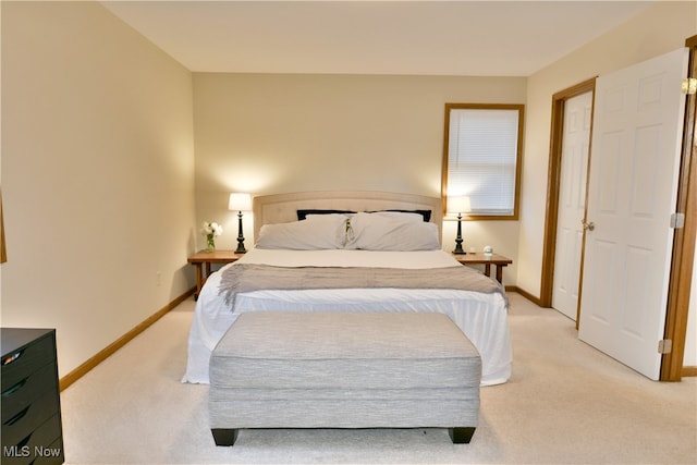 bedroom featuring light colored carpet