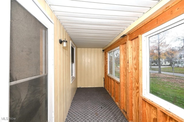 unfurnished sunroom with plenty of natural light