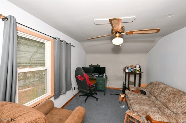 carpeted home office with vaulted ceiling and ceiling fan